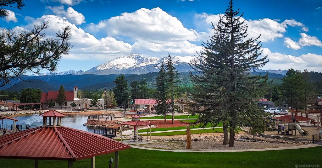 Overlooking a park with a lake, mountain in the background, in Woodland Park. 