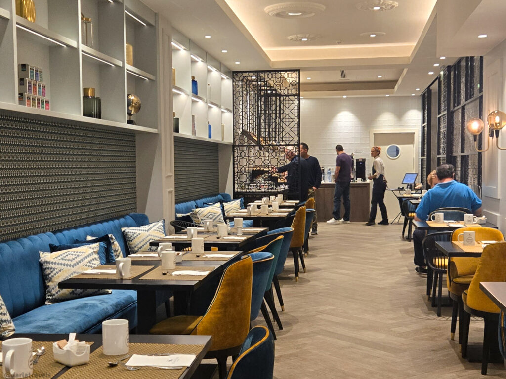 A photo of a breakfast buffet room in a hotel dining area.