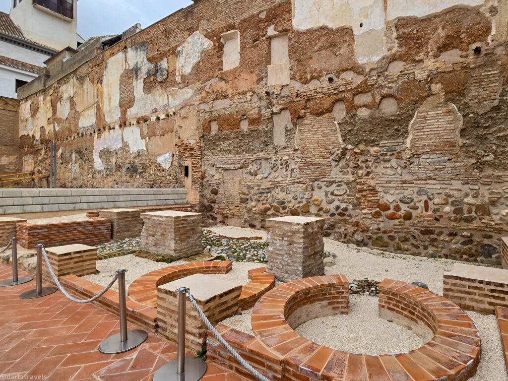 A photo showing the excavated ruins of El Maristán, a historic hospital in Granada, now a Dobla de Oro monument. The image depicts sections of the former royal mint
