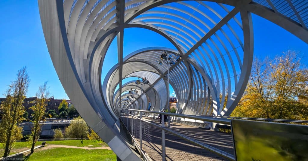 view of a sprial pedestrian bridge Madrid Rio Park