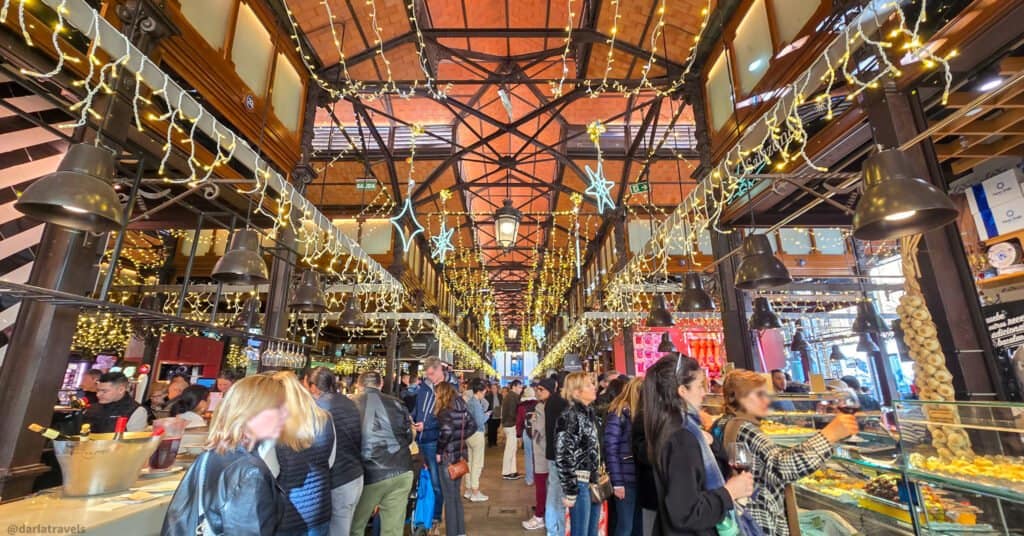 an aisle at a crowded food market 