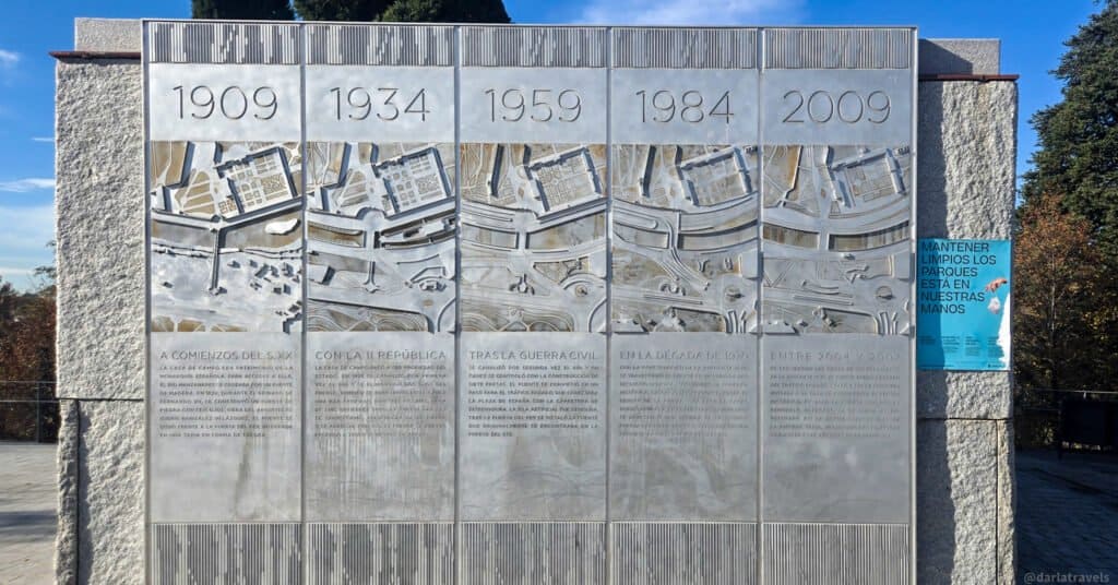 stone mural showing a timeline of the area 's layout from 1909-2009