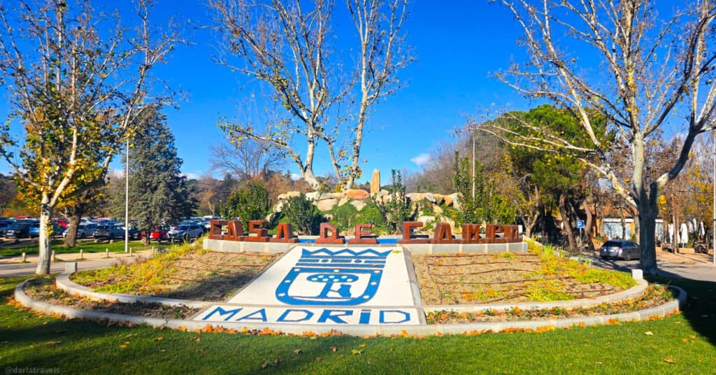 roundabout decorated with flowers and lettering of "Casa de Camp" and "Madrid"