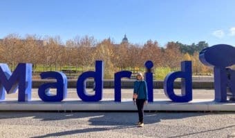 Blue "Letters sign" spelling "Madrid" with Madrid symbol of a bear and madrono tree