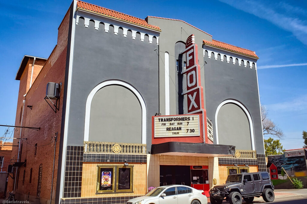 Classic Fox Theater marquee in downtown La Junta, Colorado, showing weekend movie listings.