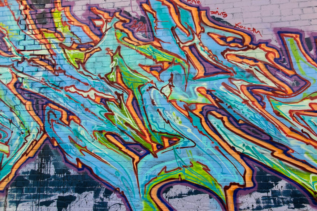 Abstract graffiti mural with bold lines and colors in downtown La Junta, Colorado.