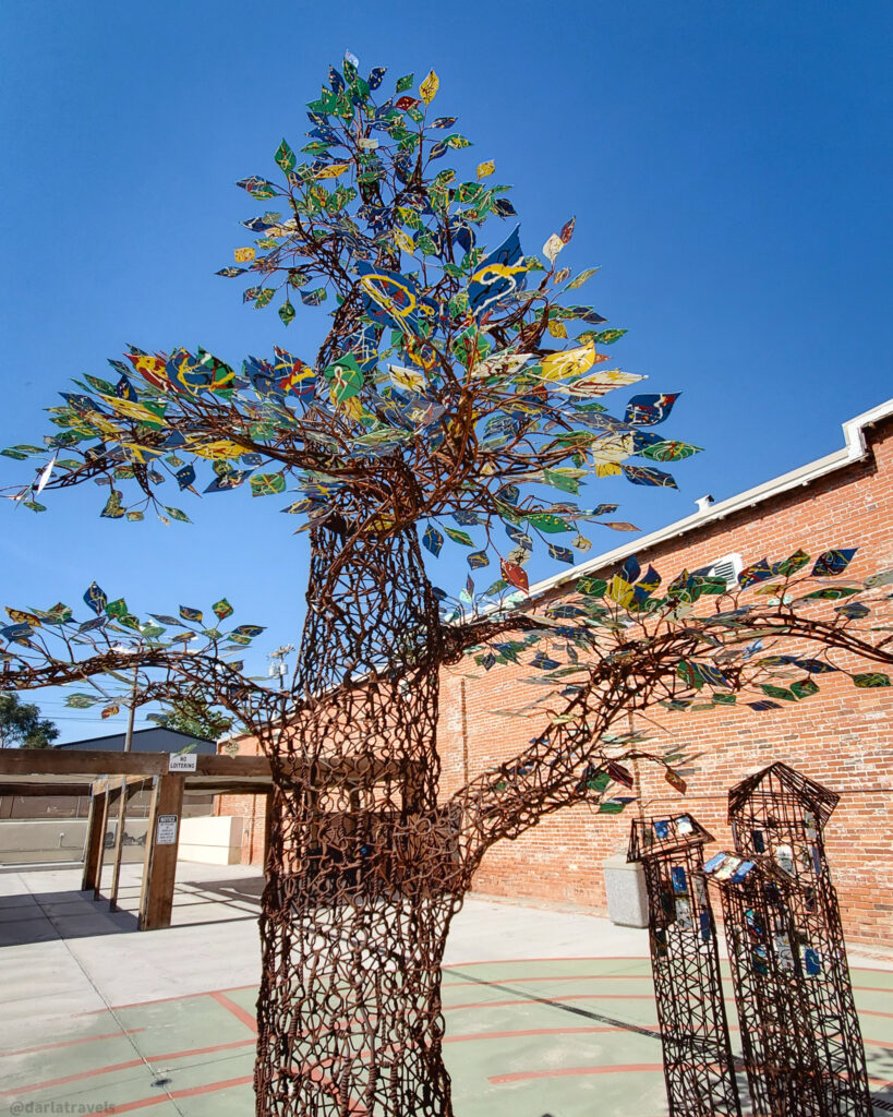 Whimsical metal tree sculpture in La Junta, Colorado, LiveWell park.