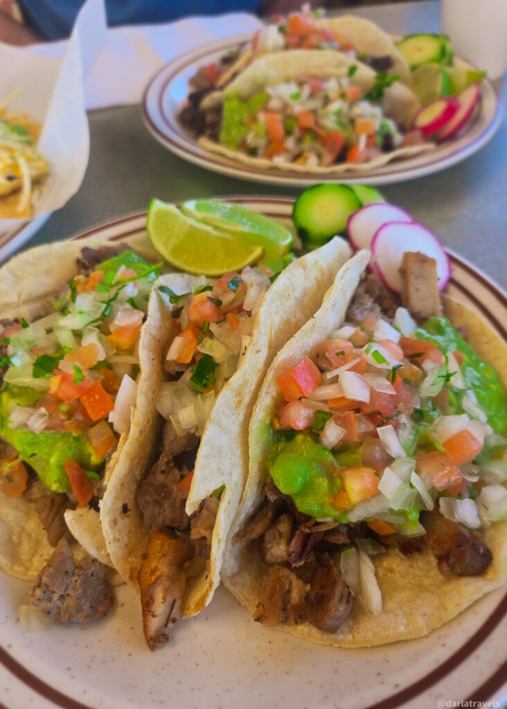 Street-style tacos with guacamole, onions, and lime at local eatery in La Junta, Colorado.
