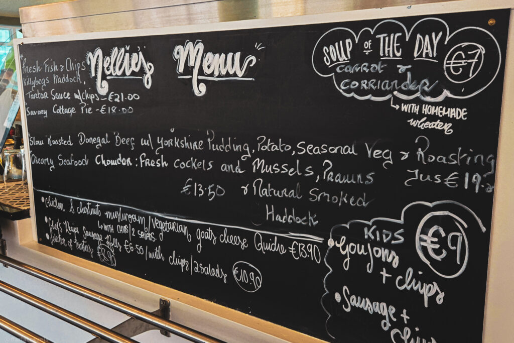 Handwritten chalkboard menu at Nellie’s restaurant in Donegal featuring local seafood and comfort dishes