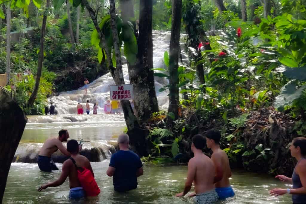 Conservation sign reminding visitors not to damage rocks while enjoying Dunn’s River Falls.
