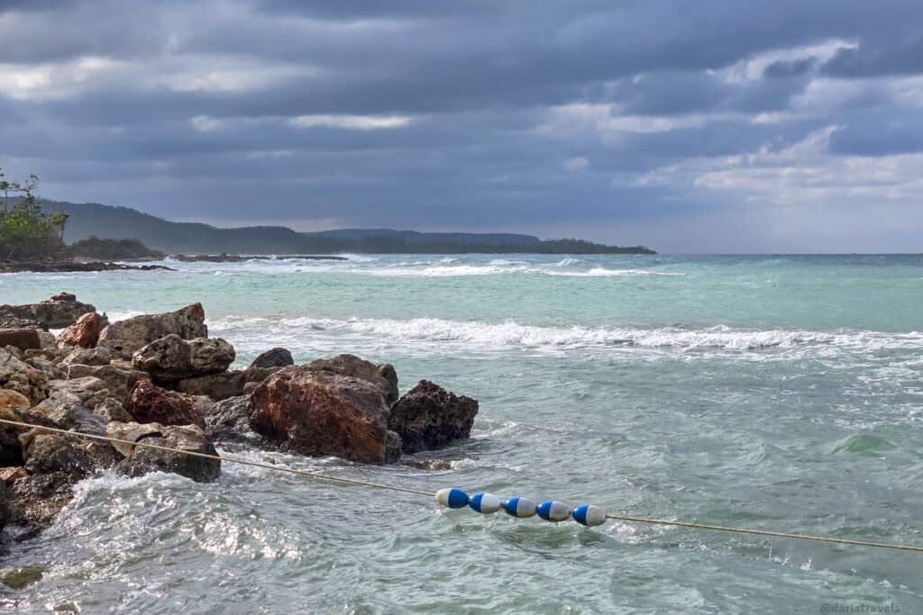 Coastal view at Bamboo Beach Club, Falmouth, Jamaica, showing the shoreline where visitors relax before or after excursions.