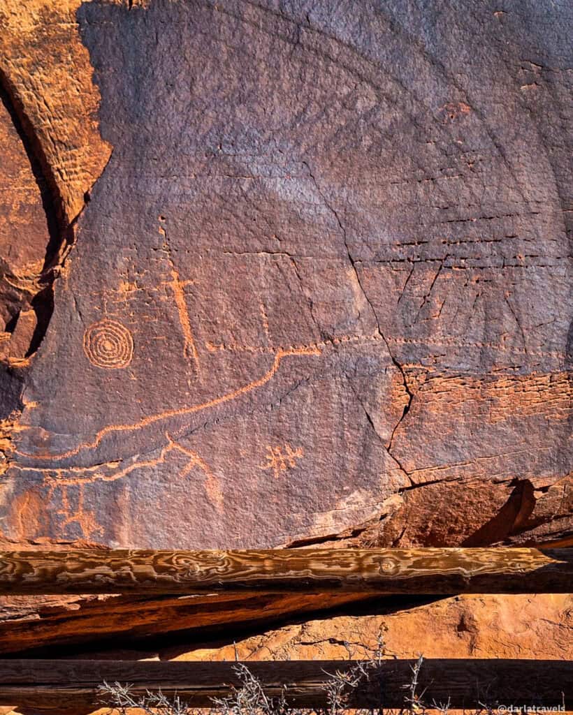 Geometric petroglyphs carved into a weathered rock face near Moab