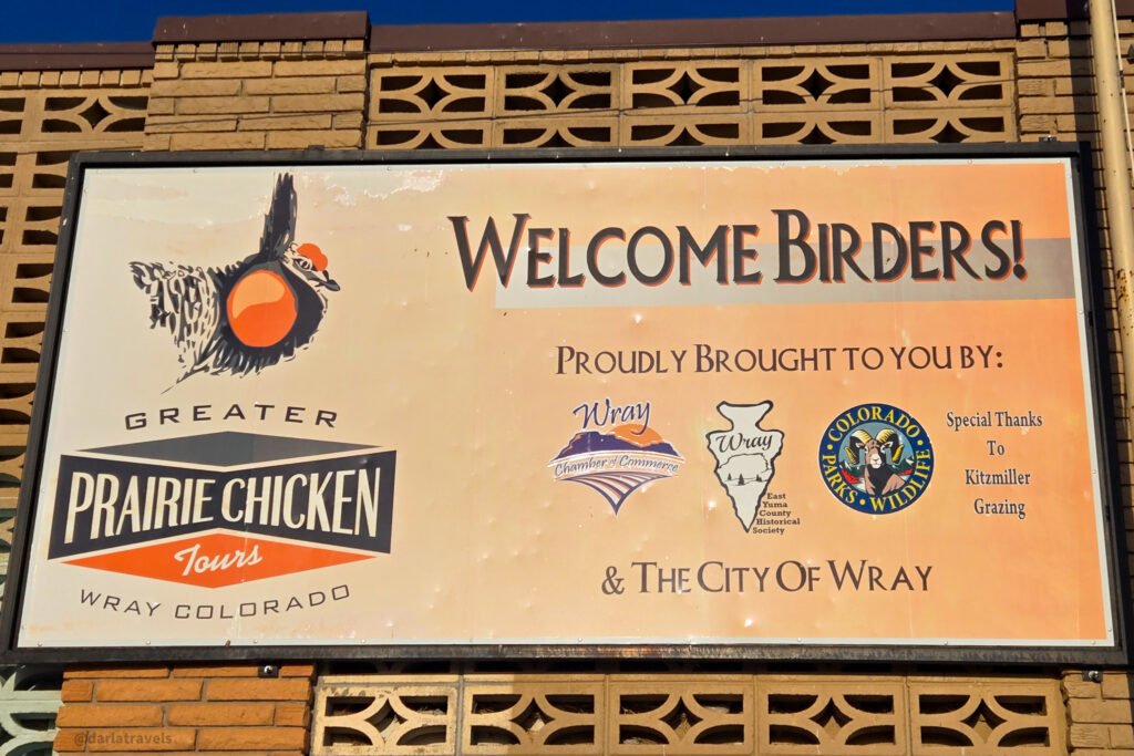 A large "Welcome Birders!" sign in Wray, Colorado, promoting Greater Prairie Chicken Tours.