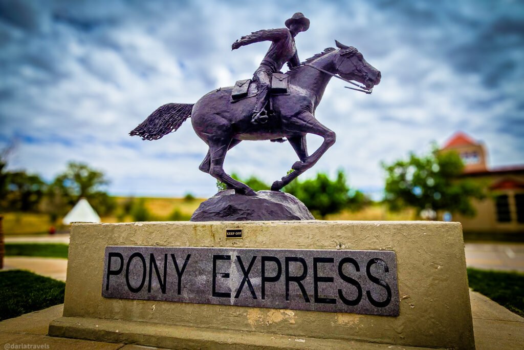 Pony Express statue of a rider on a galloping horse outside Julesburg's Colorado Welcome Center.