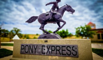 Pony Express statue of a rider on a galloping horse outside Julesburg's Colorado Welcome Center.