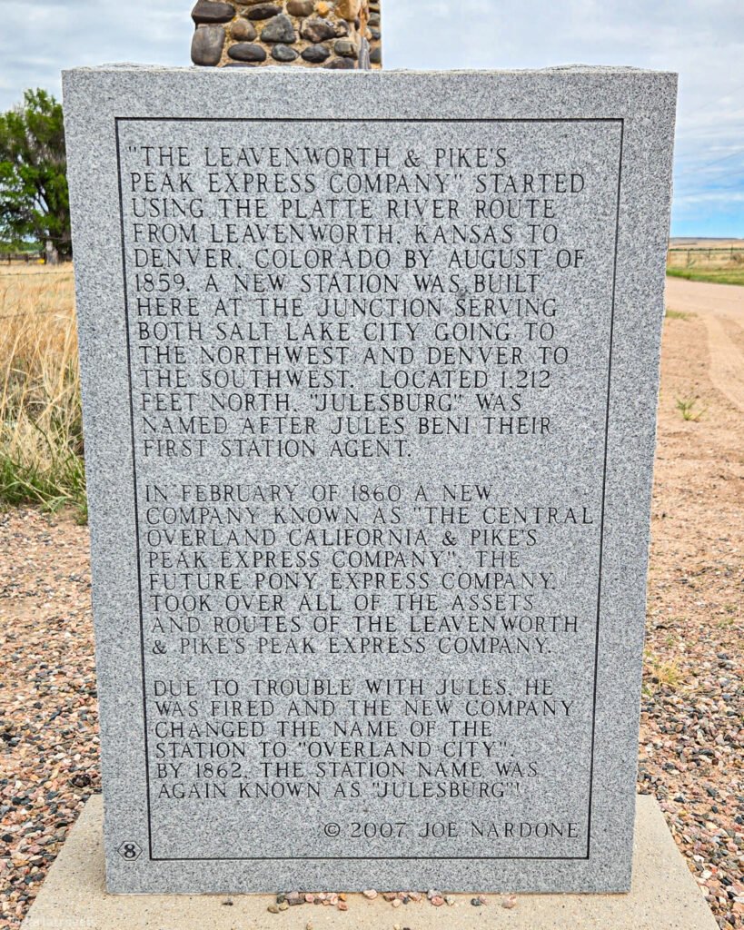 Granite historical marker describing Julesburg's stage station and its connections to the Pony Express.