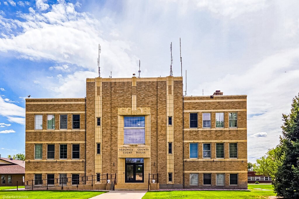 Sedgwick County Courthouse in Julesburg, with a symmetrical brick facade and decorative stone entrance.