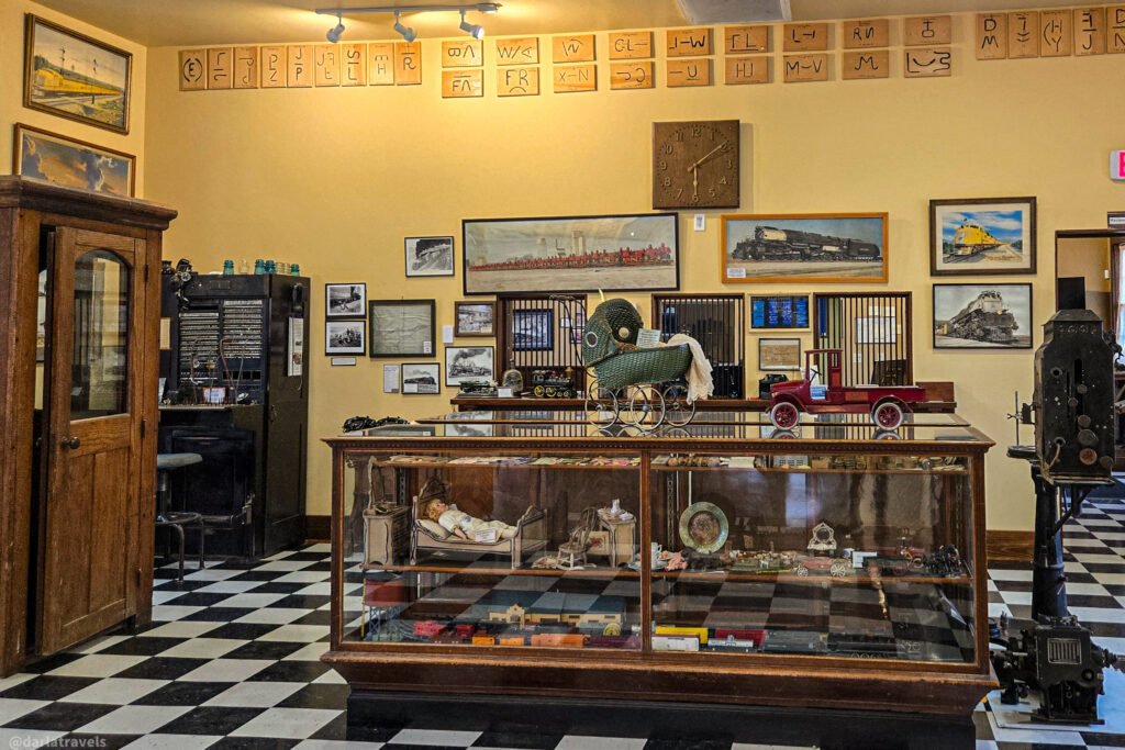 Depot Museum in Julesburg, with railroad pictures, a telephone switchboard, and antique toys in glass cases.