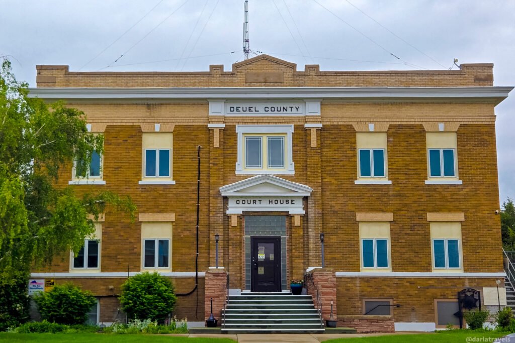 Deuel County Courthouse in Chappell, with a symmetrical brick facade and a pediment above the entrance.