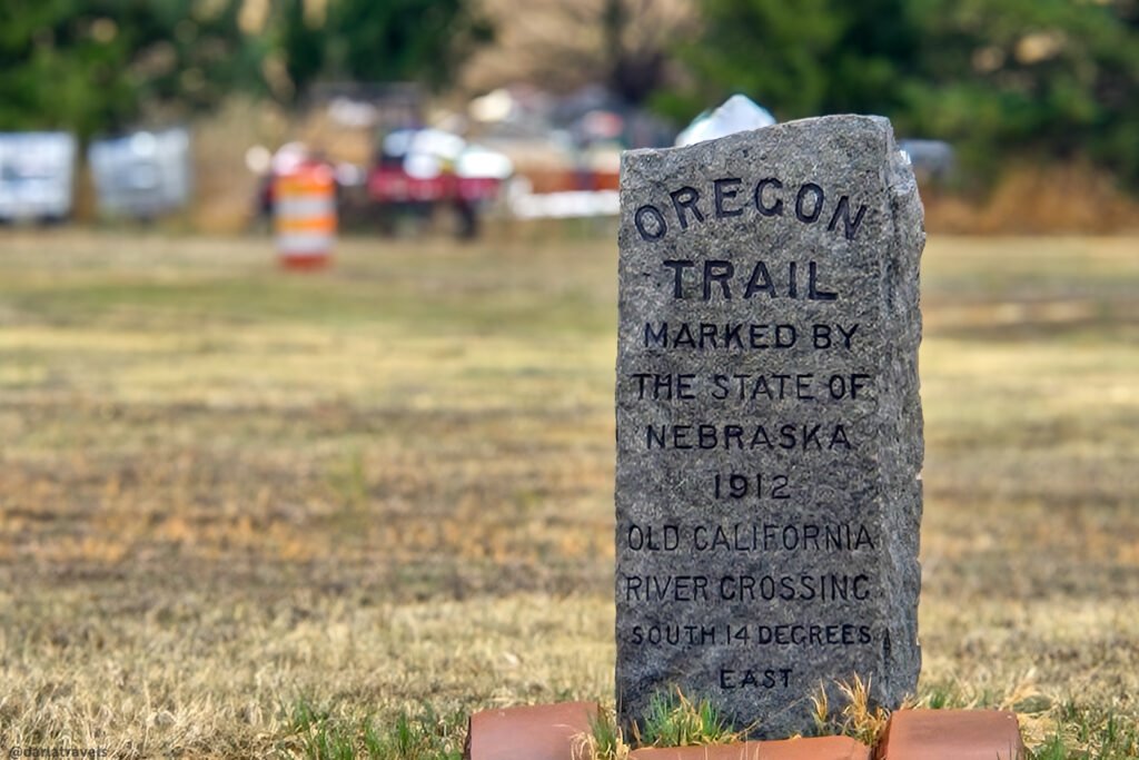 Narrow stone Oregon Trail marker directing visitors toward the Old California River Crossing near Brule.